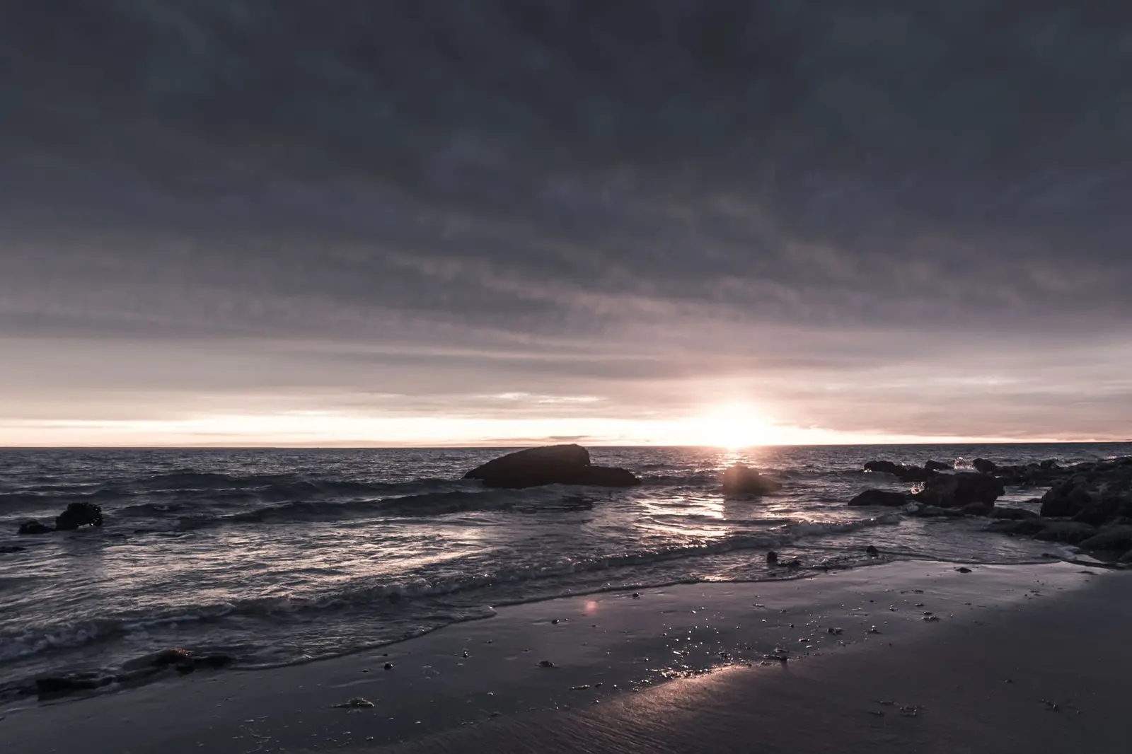 Calm ocean coastline at sunrise, a symbol of hope and new beginnings